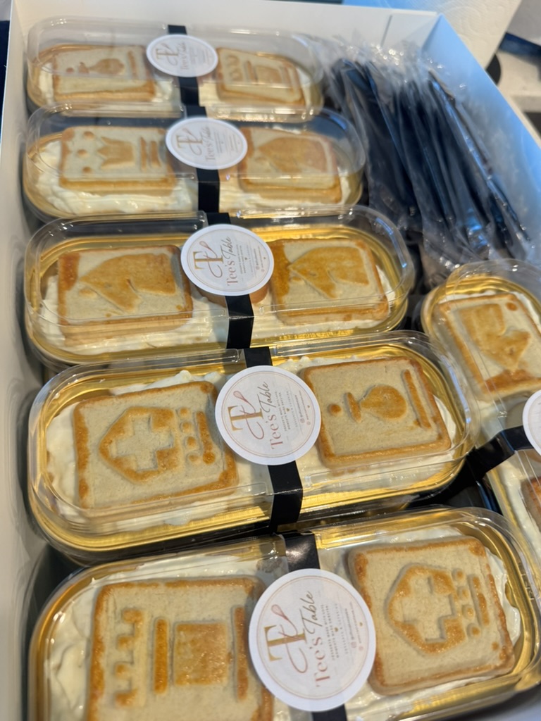 Boxed order of banana pudding mini desserts ready for an event