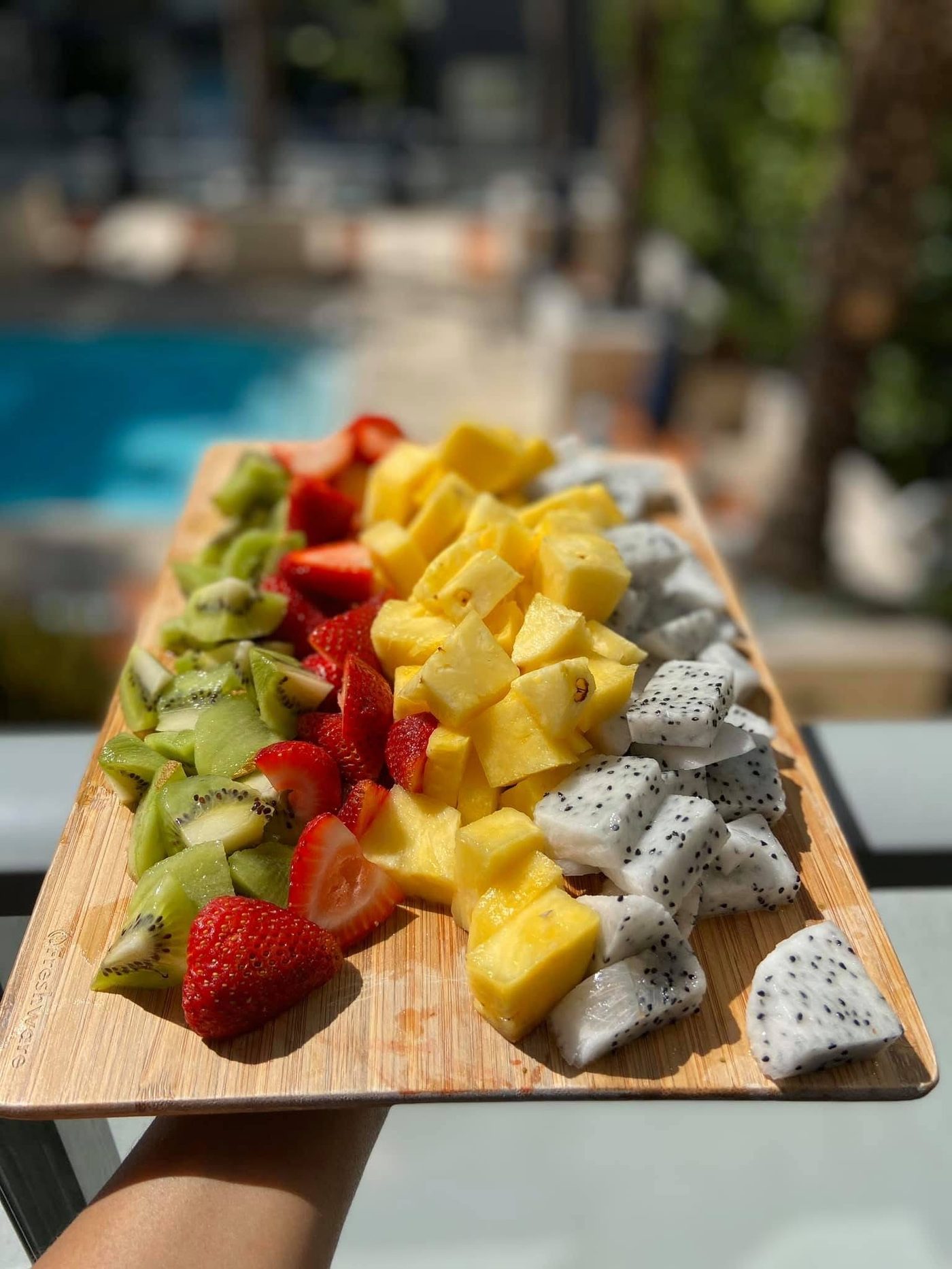 Fresh fruit platter with strawberries, kiwi, mango, and dragon fruit